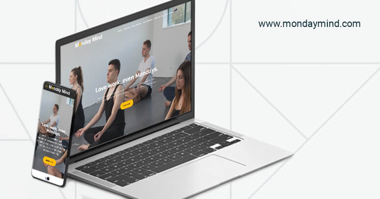 A laptop and a phone showing the Monday Mind Website