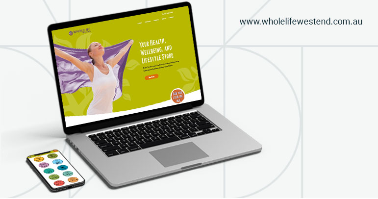 Image of a phone and a laptop showing the Wholelife Westend Website